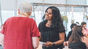 A former mentee attending their staff mentoring programme graduation
