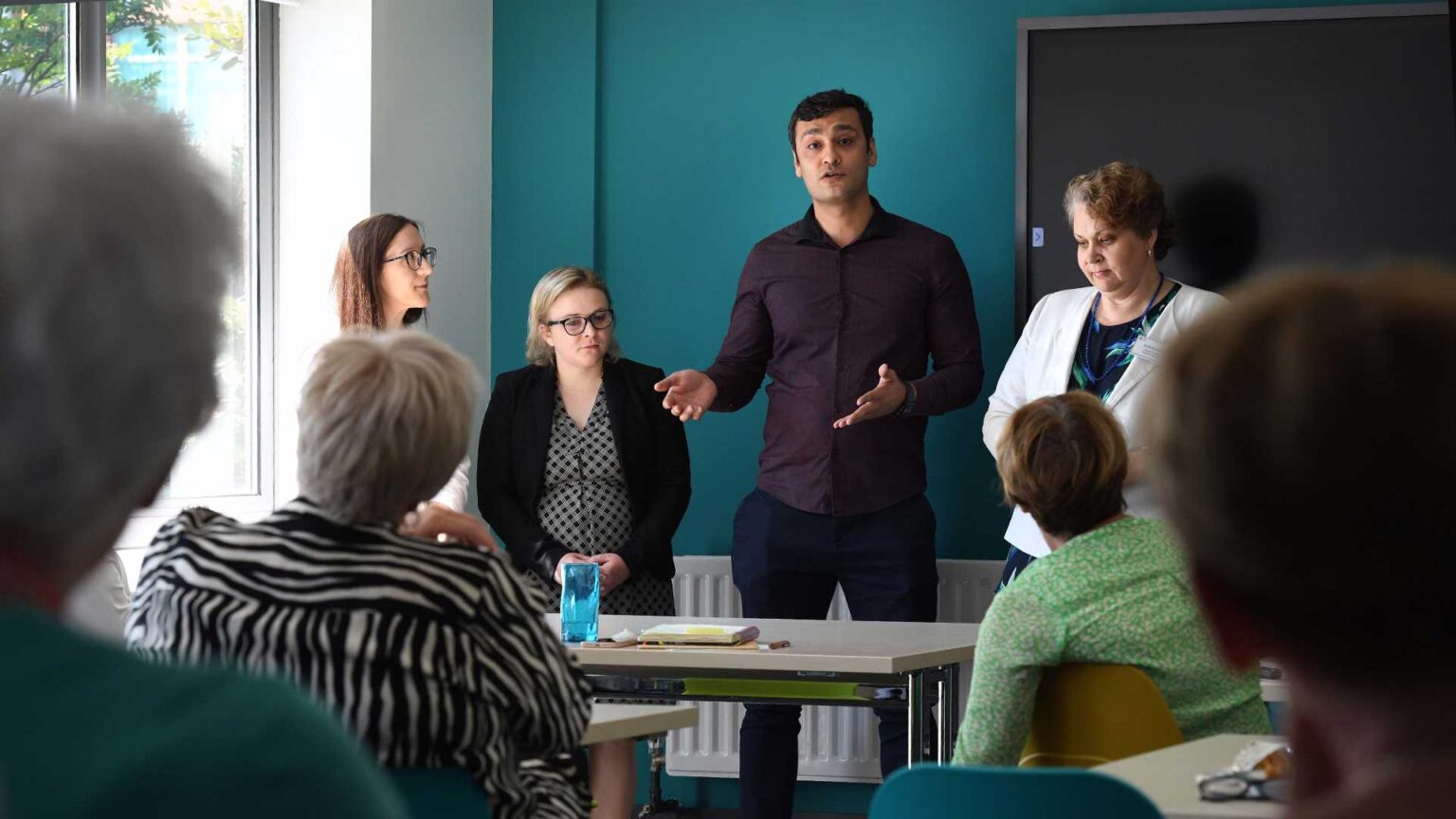 Stock image: man giving a talk on board governance
